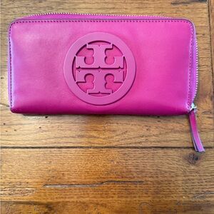 Tory Burch Fuchsia Zip-Around Wallet.